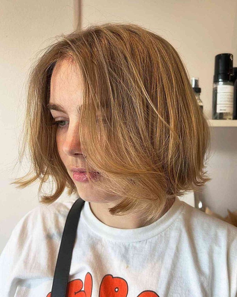 chin length italian blonde bob with natural texture