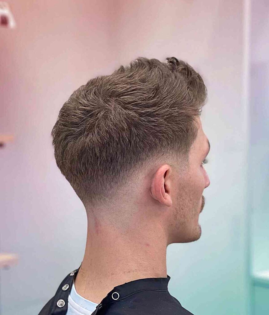 low buzz fade on guys short textured and blonde hair