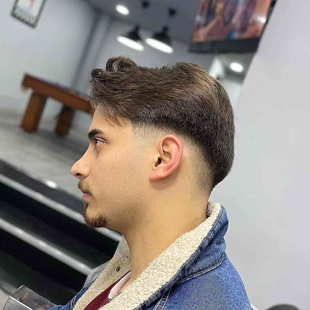 low fade cut and loose texture style for men