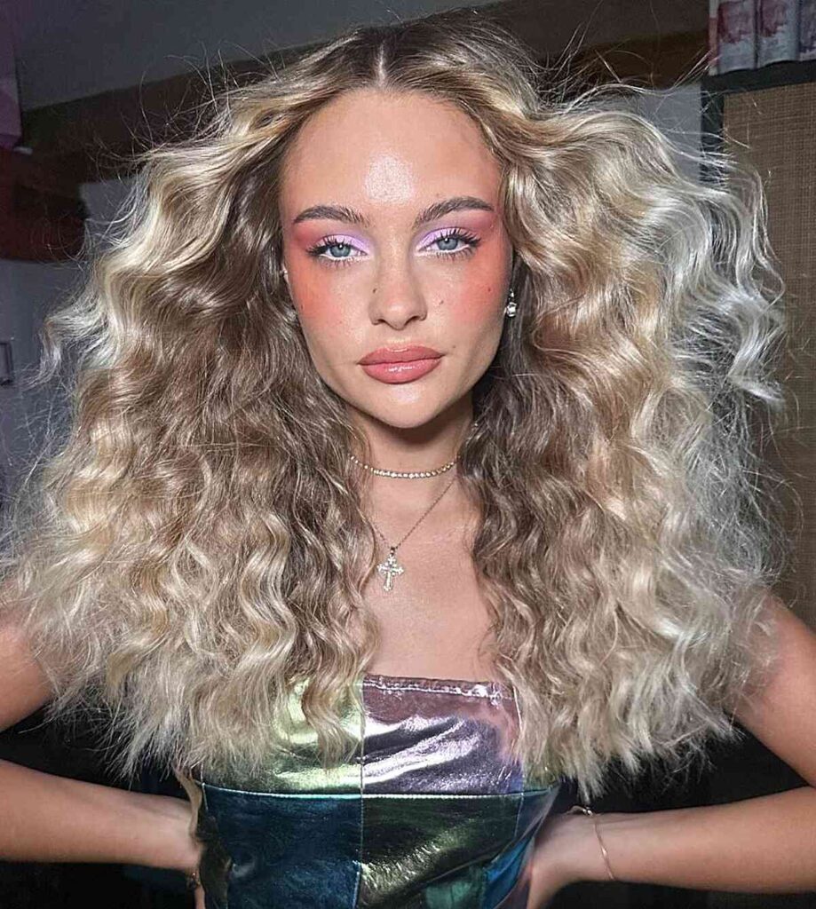 70s wavy disco hair with middle part