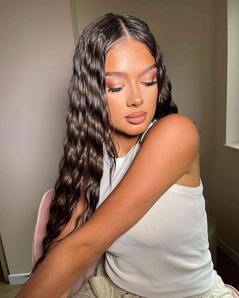 90s inspired wet wavy look with center part