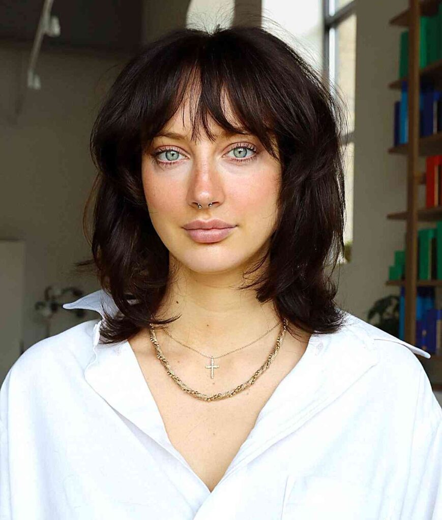 90s mid length layered cut with wispy bangs
