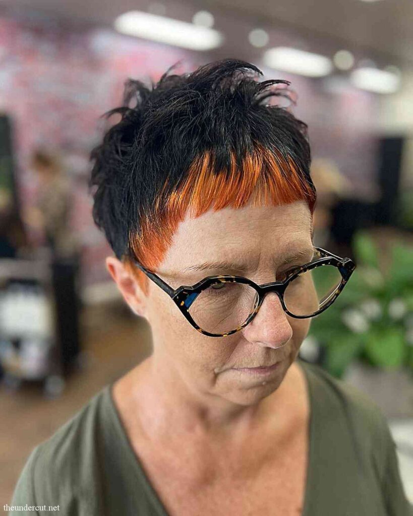 black messy pixie with orange bangs for mature women