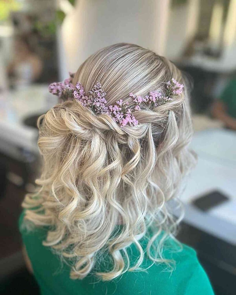 curled mid length hair with flowers for festivals and events