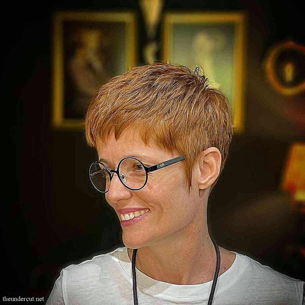 ginger pixie with short fringe for 50 year old women with glasses