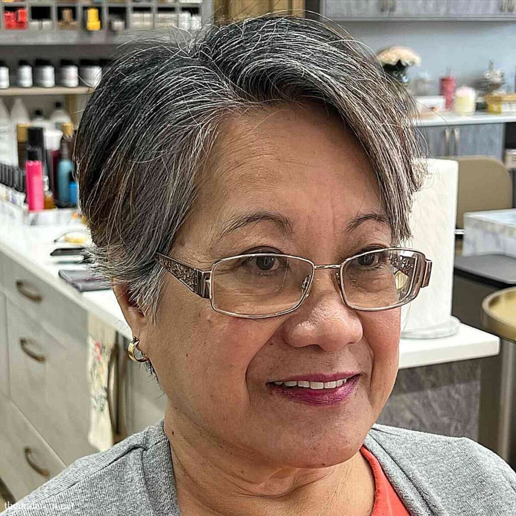 gray long pixie with side part on 50 year old women with glasses