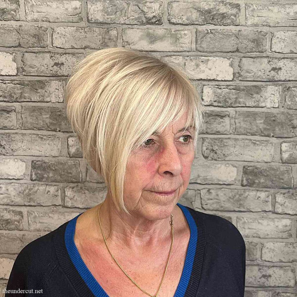 high stacked thick bob with face frame and bangs for 60 year old ladies