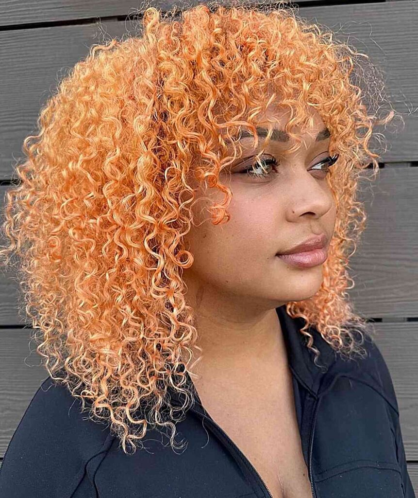 light peach curly hair with bangs for festivals