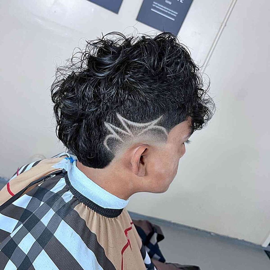 low burst fade long hair with shaved design for guys