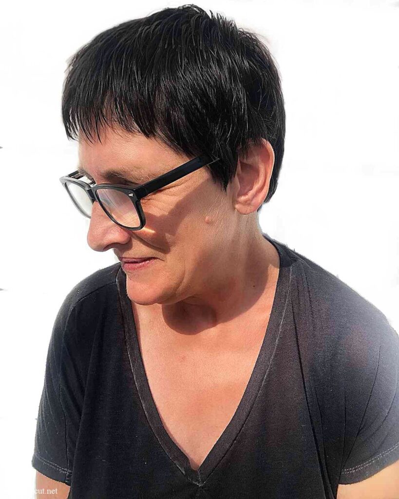 low maintenance short pixie hair with choppy bangs for ladies aged 50 with eyeglasses
