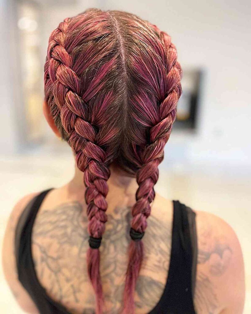 rosy pink hair with festival boxer braids