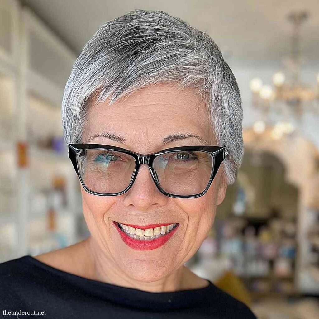 salt and pepper short pixie haircut on ladies over 50 wearing glasses