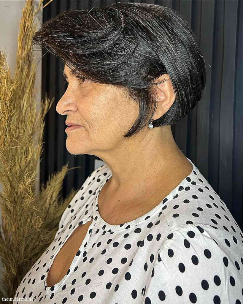 short voluminous wedge bob with layered bangs for thick hair over 60