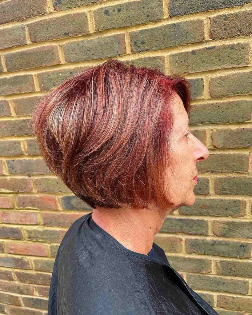 shorter red balayage bob with blonde accents for older women