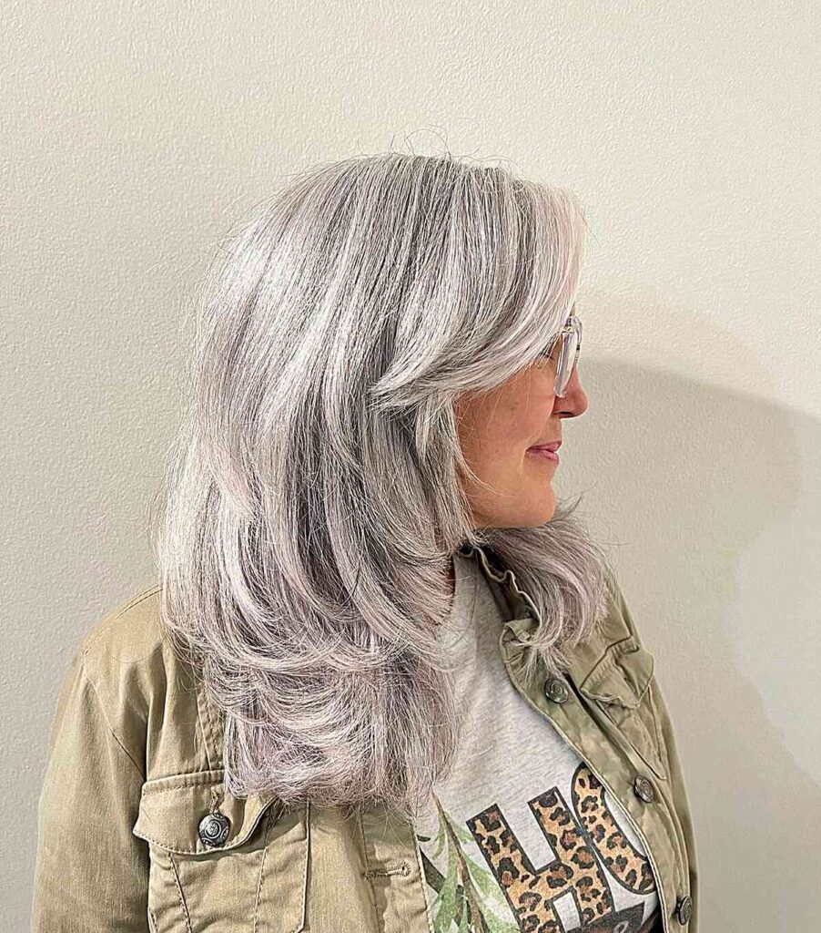 silver blonde hair with feathered layers for older women with grey hair