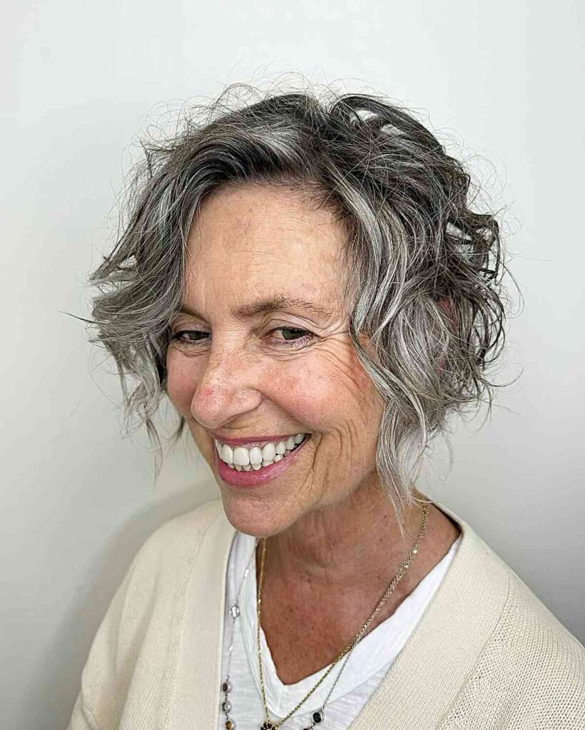 silver tousled bob with dark roots for senior women