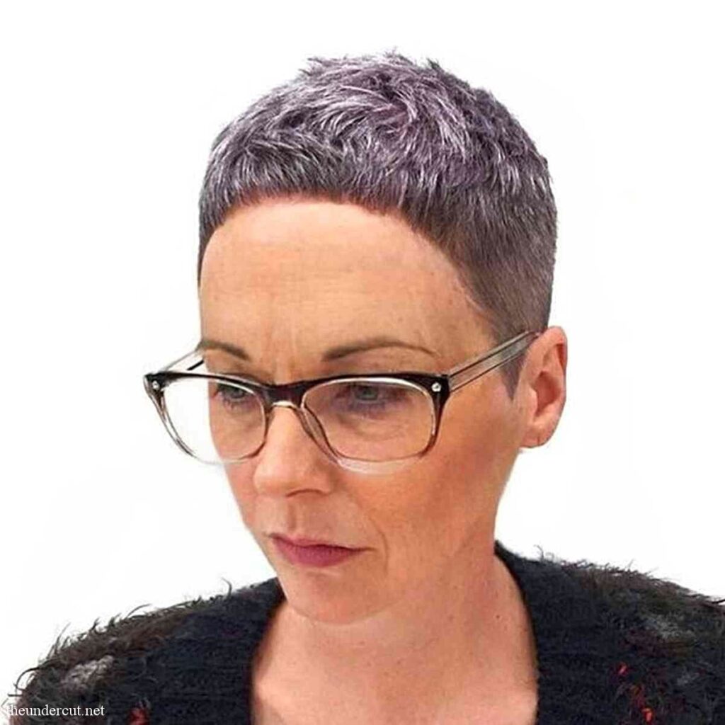 super short classic pixie on ladies in their 50s wearing glasses