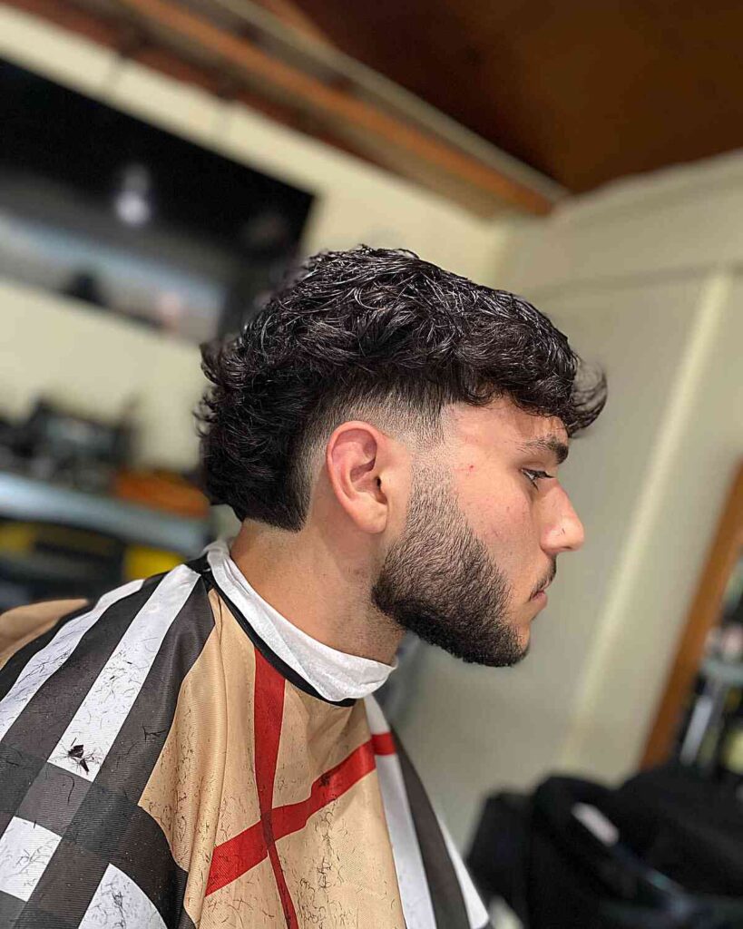 textured low burst fade haircut for men