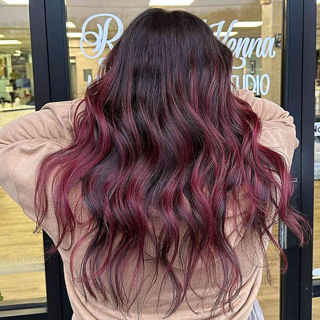 wavy black hair with cherry cola highlights