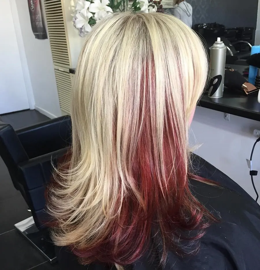 feathered blonde hair with red underneath.jpg