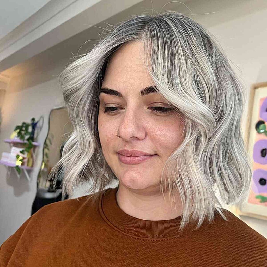 icy blonde bob with soft waves for fuller shaped faces