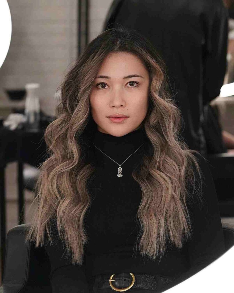 long wavy hair with choppy ends for round faces