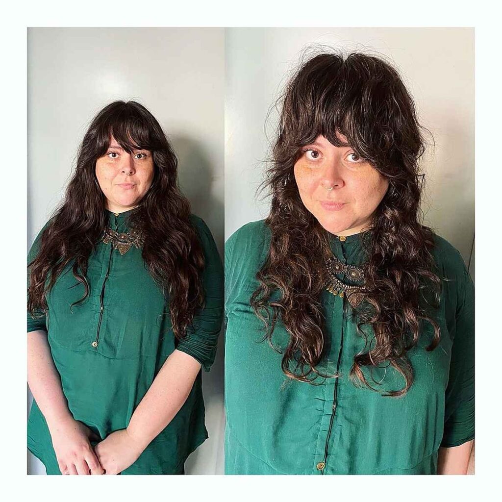messy shag cut with curtain bangs for women over forty with wavy hair