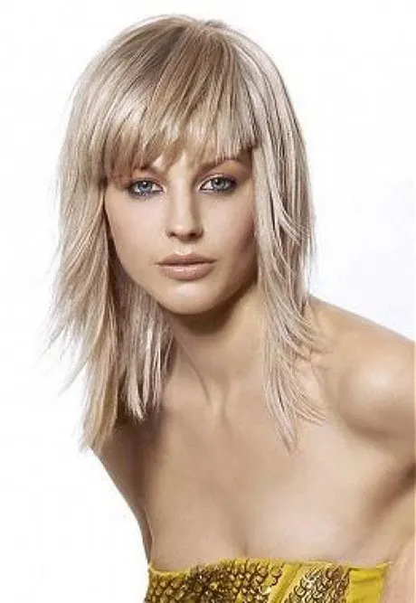pictures of medium length haircuts with bangs