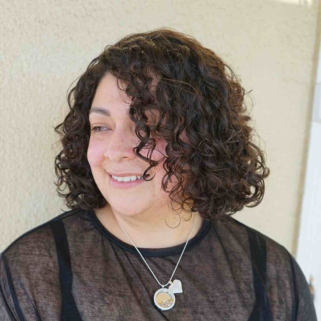 side parted textured curly bob for round faces