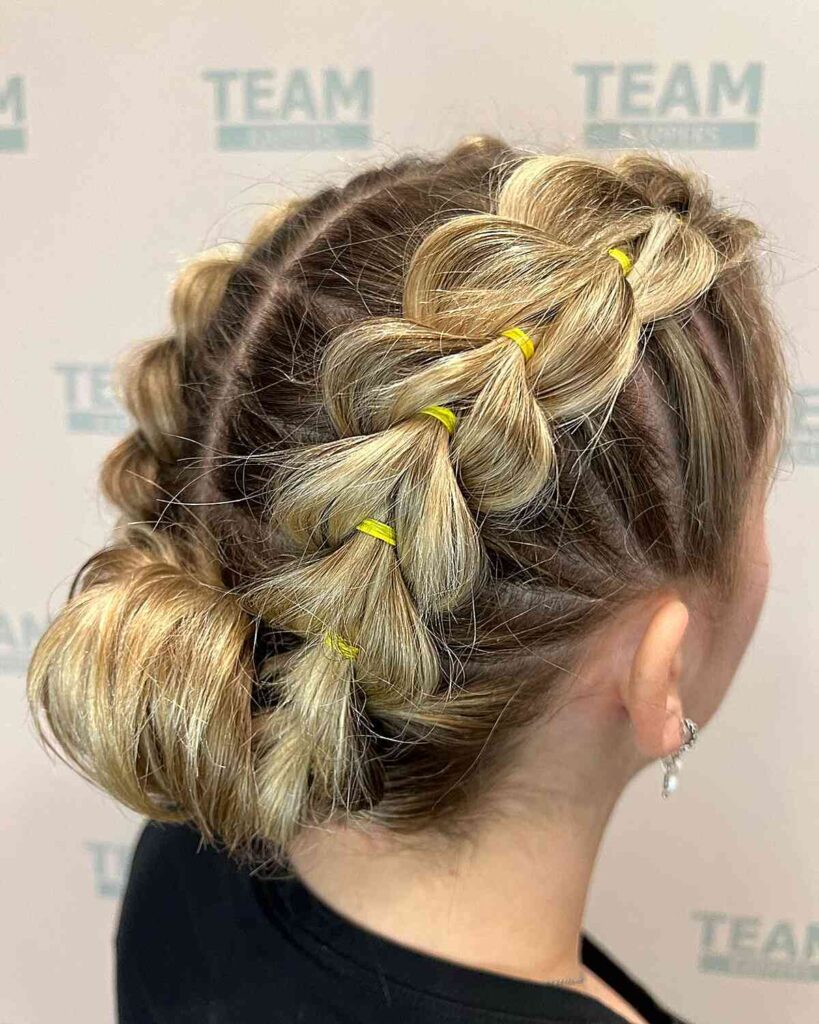simple double pull through braids and a roll bun