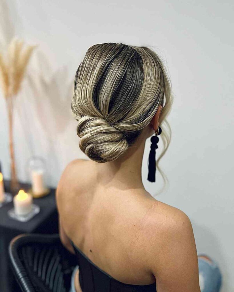 simple loosely styles twisted low middle bun updo
